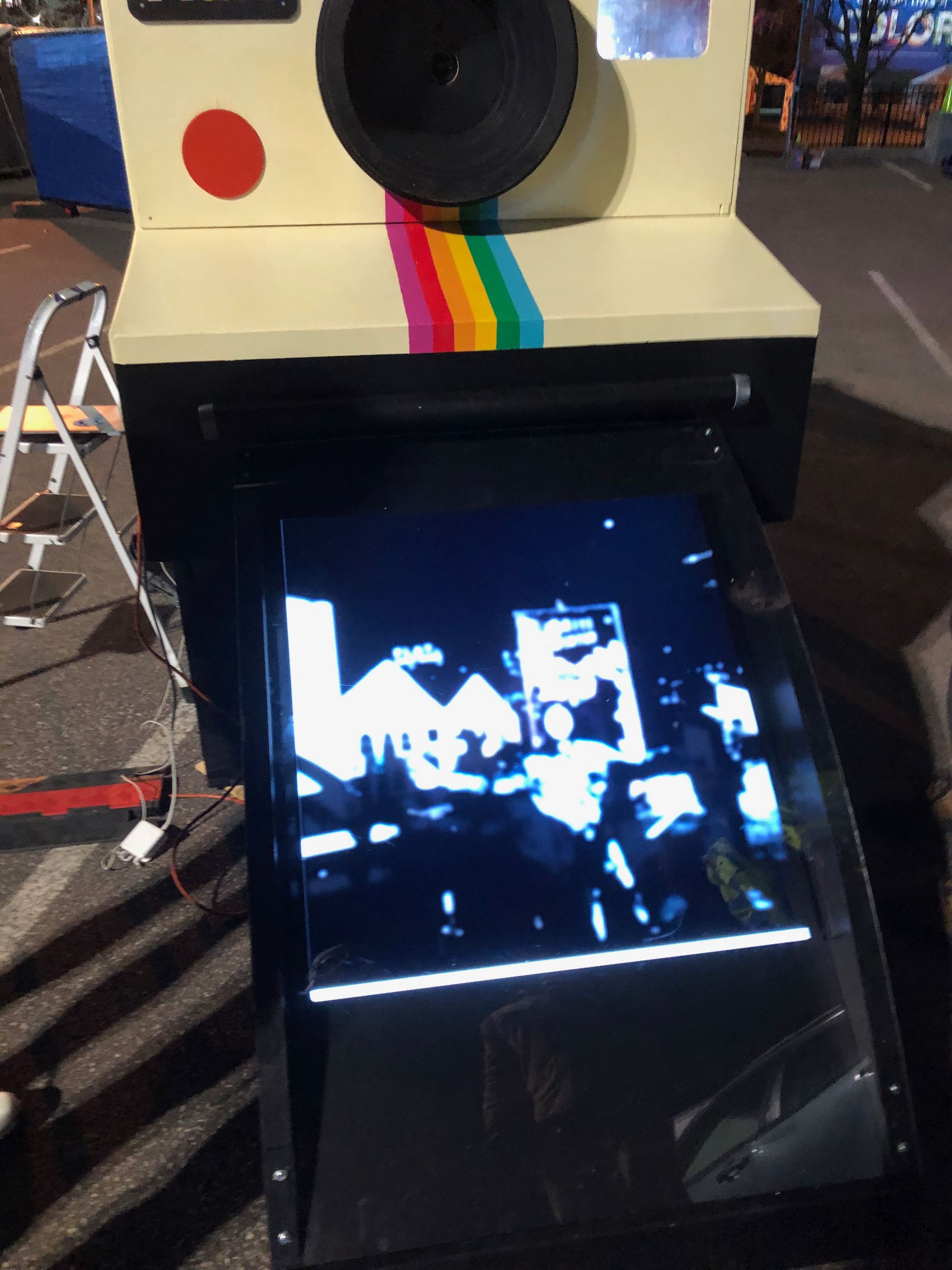 Shows a blurry Polaroid shot "developing" during final testing on site.